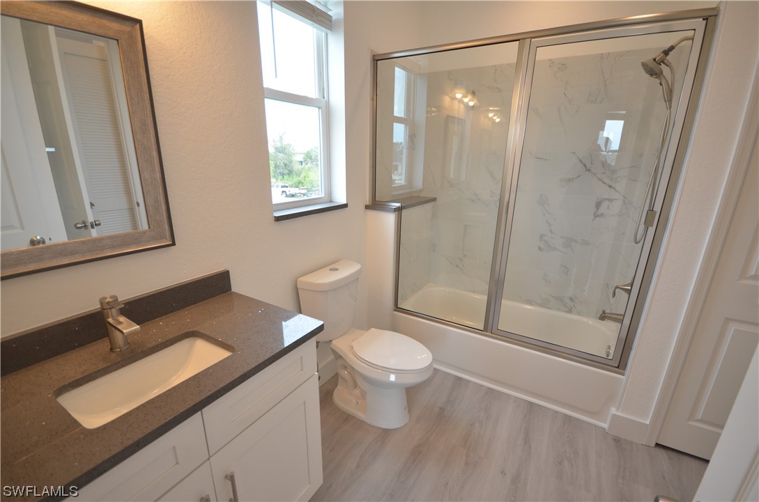 8581 Agate Street Port Charlotte, FL 33981 - Photo 50 of 50 a bathroom with a sink a toilet and shower