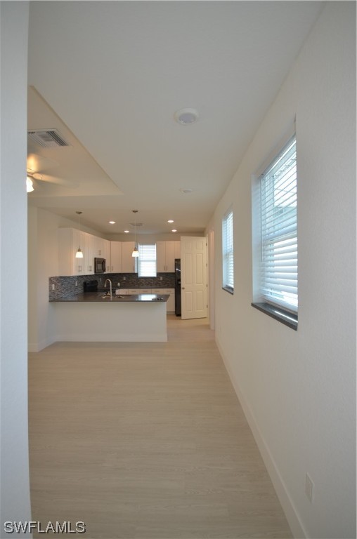 8581 Agate Street Port Charlotte, FL 33981 - Photo 10 of 50 a view of kitchen and kitchen with stainless steel appliances