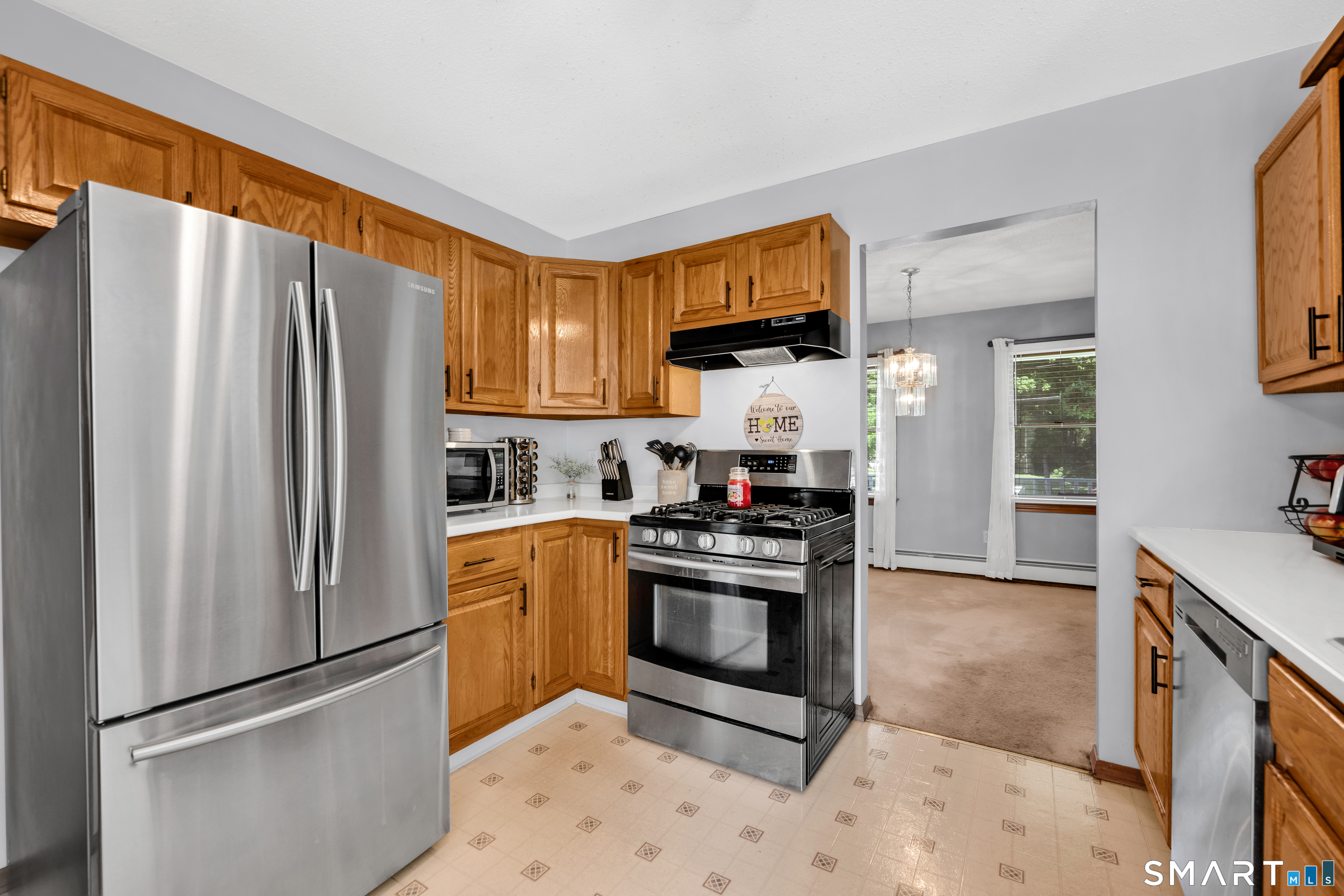 89 Windsorville Road South Windsor, CT 06074 - Photo 3 of 23 a kitchen with stainless steel appliances granite countertop a refrigerator stove and sink