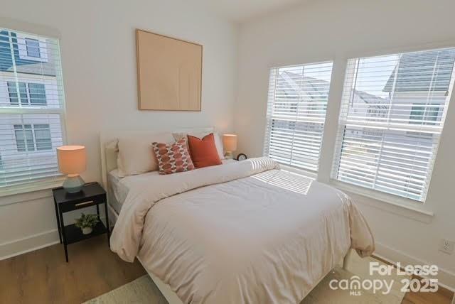 2019 Caldera Street Charlotte, NC 28208 - Photo 23 of 25 a bedroom with a bed and a window