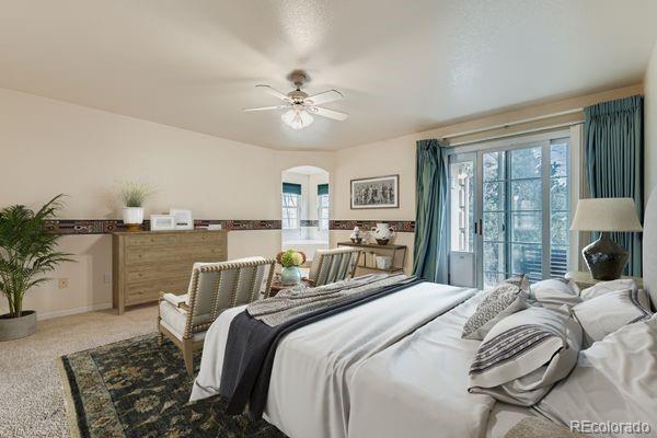 213 Elizabeth Court Fort Lupton, CO 80621 - Photo 15 of 27 a bedroom with a large bed and a chandelier