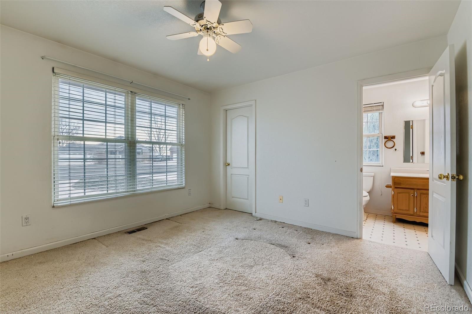 213 Elizabeth Court Fort Lupton, CO 80621 - Photo 21 of 27 a view of an empty room with a window