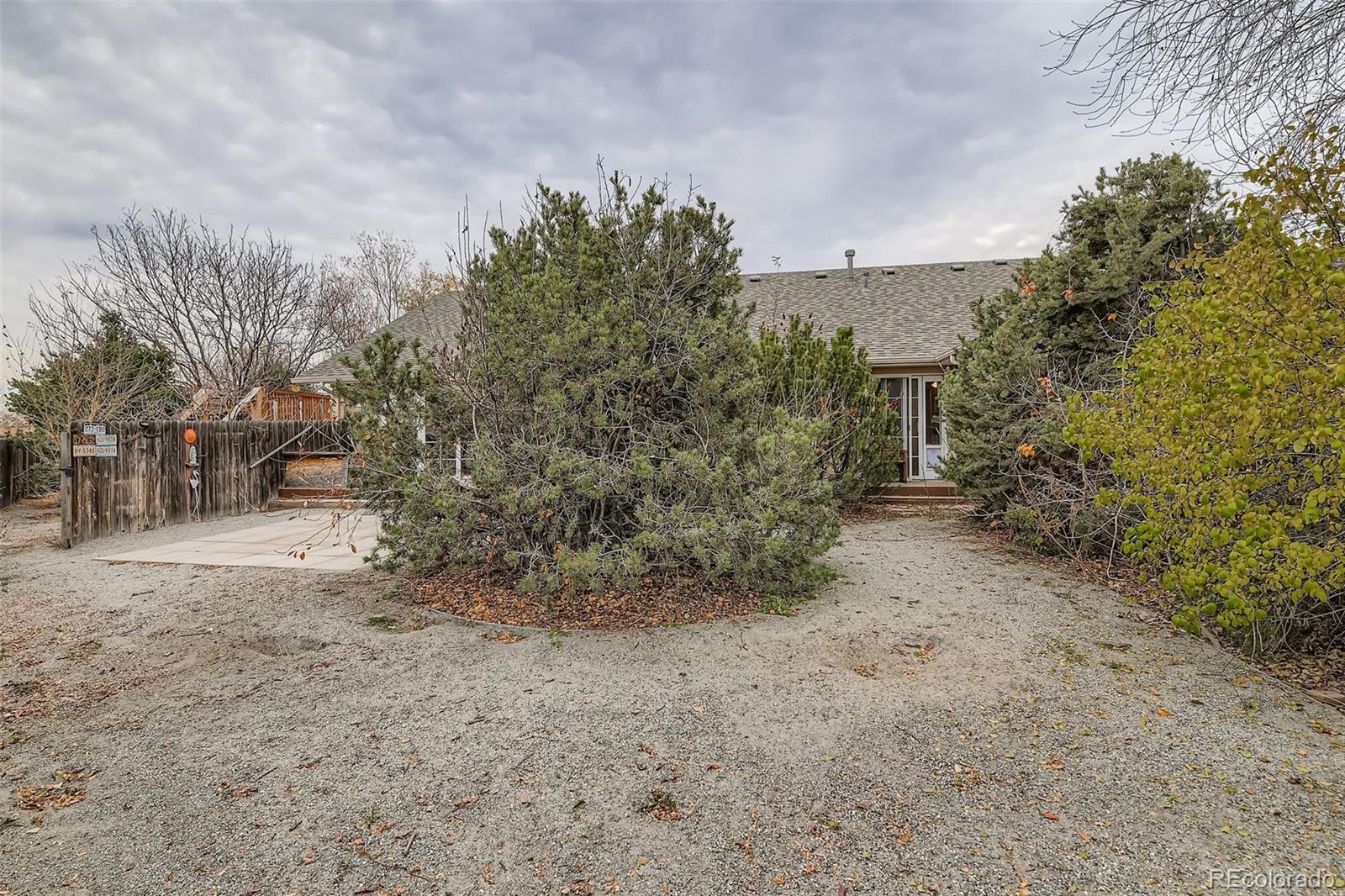 213 Elizabeth Court Fort Lupton, CO 80621 - Photo 24 of 27 a view of a yard with plants and trees