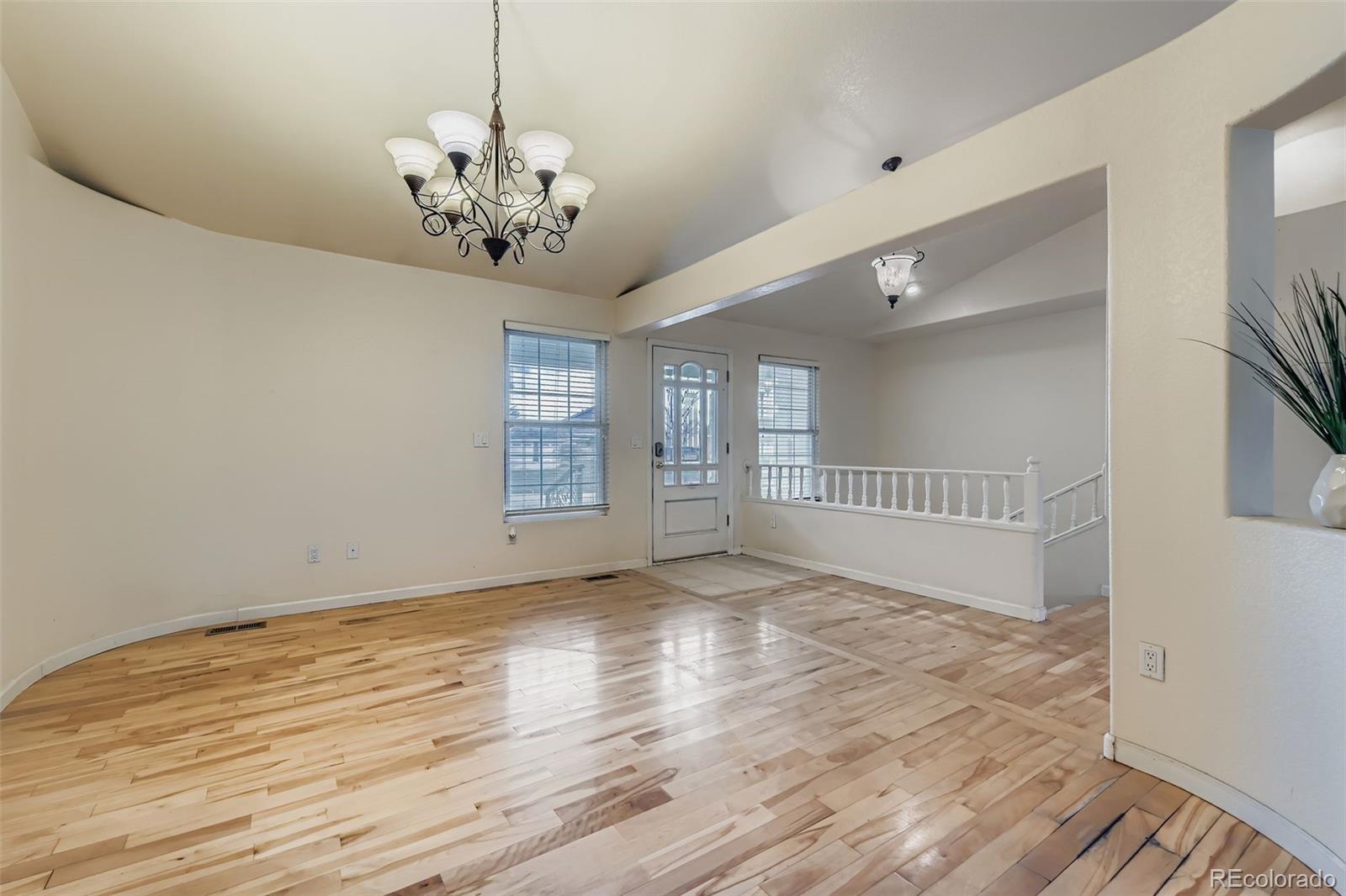 213 Elizabeth Court Fort Lupton, CO 80621 - Photo 3 of 27 a view of an empty room with a window
