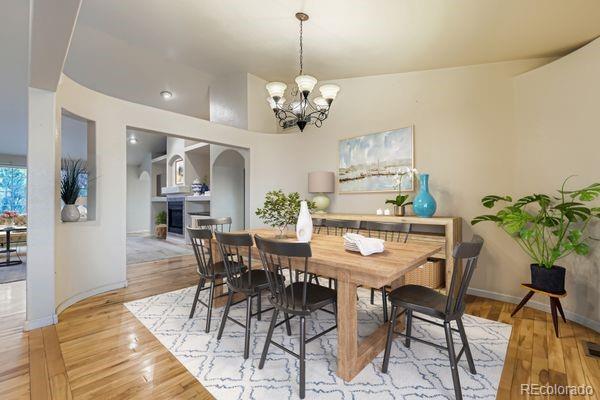 213 Elizabeth Court Fort Lupton, CO 80621 - Photo 5 of 27 a view of a dining room with furniture and wooden floor