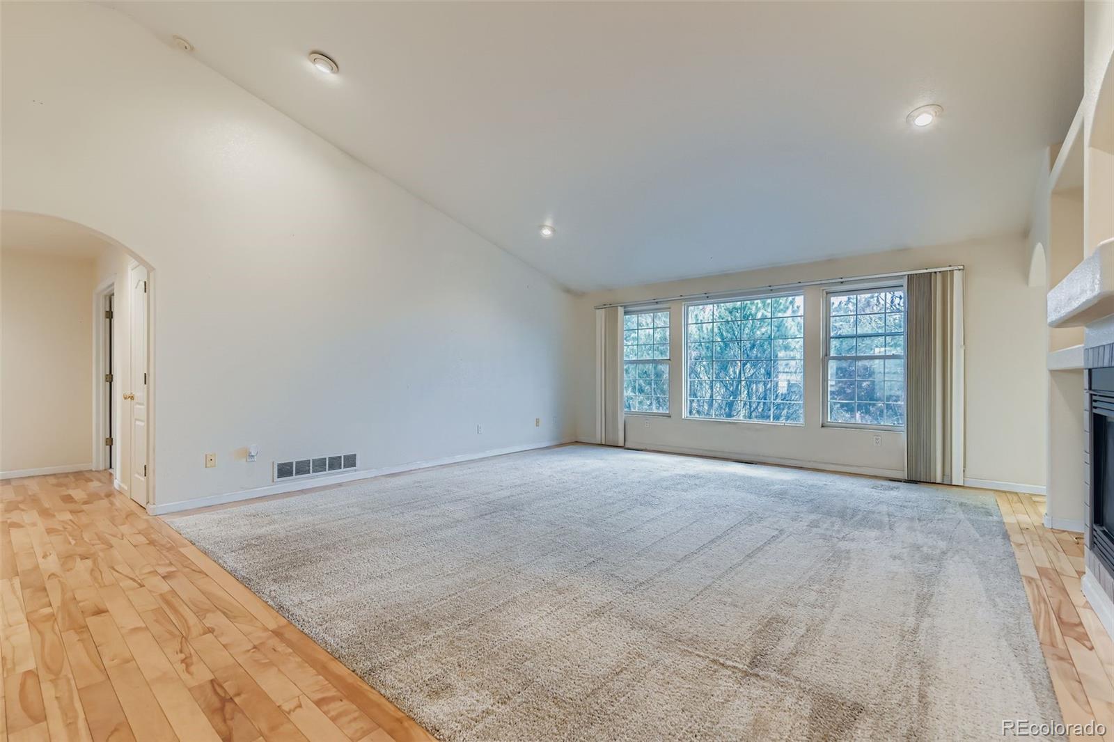 213 Elizabeth Court Fort Lupton, CO 80621 - Photo 6 of 27 a view of an empty room with a window