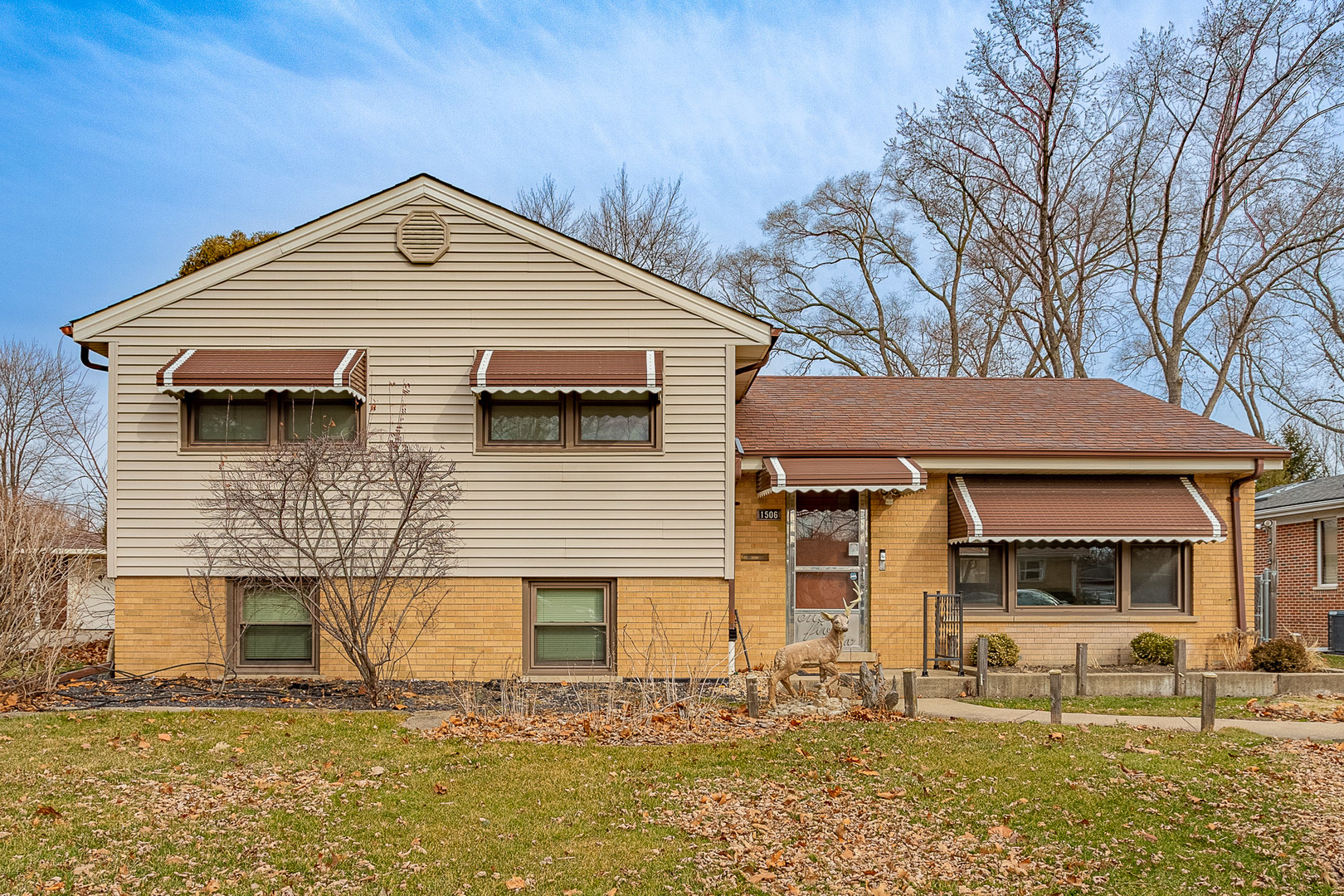 1506 West Palm Drive Mount Prospect, IL 60056 - Photo 1 of 19 a front view of a house with a yard