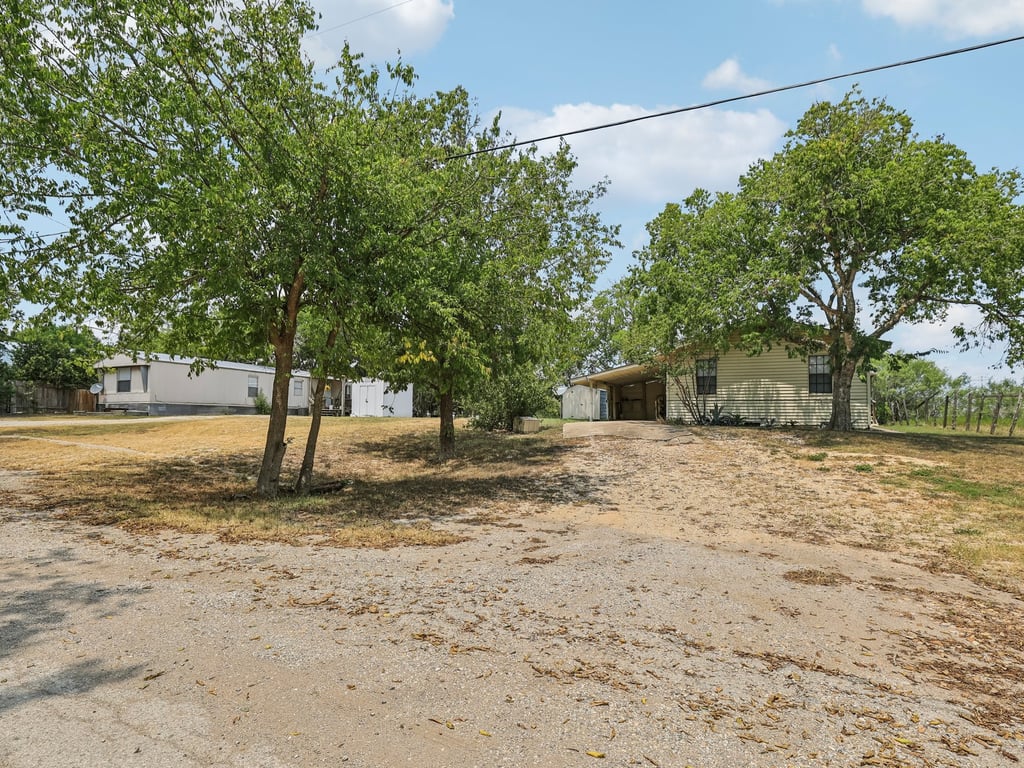 Tbd Tbd Bluebonnet Road Lockhart, TX 78644 - Photo 16 of 20 a view of a yard with plants and trees