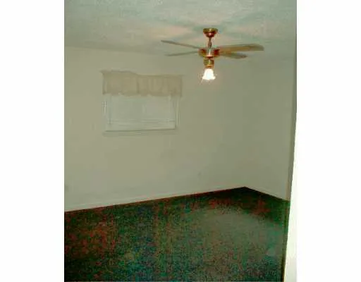 a view of a small space with a fan