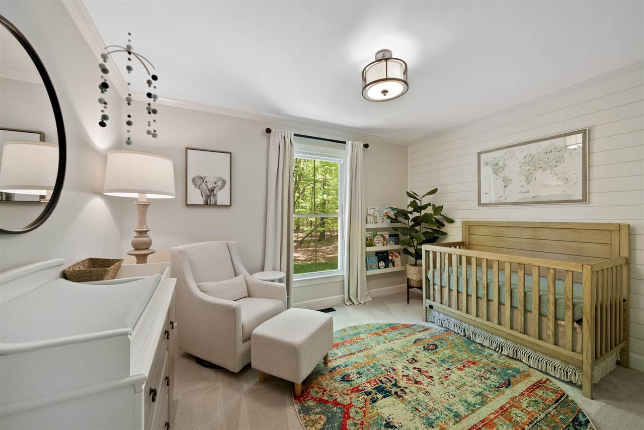 9421 Barton Creek Road Raleigh, NC 27615 - Photo 14 of 30 a bedroom with furniture and a window