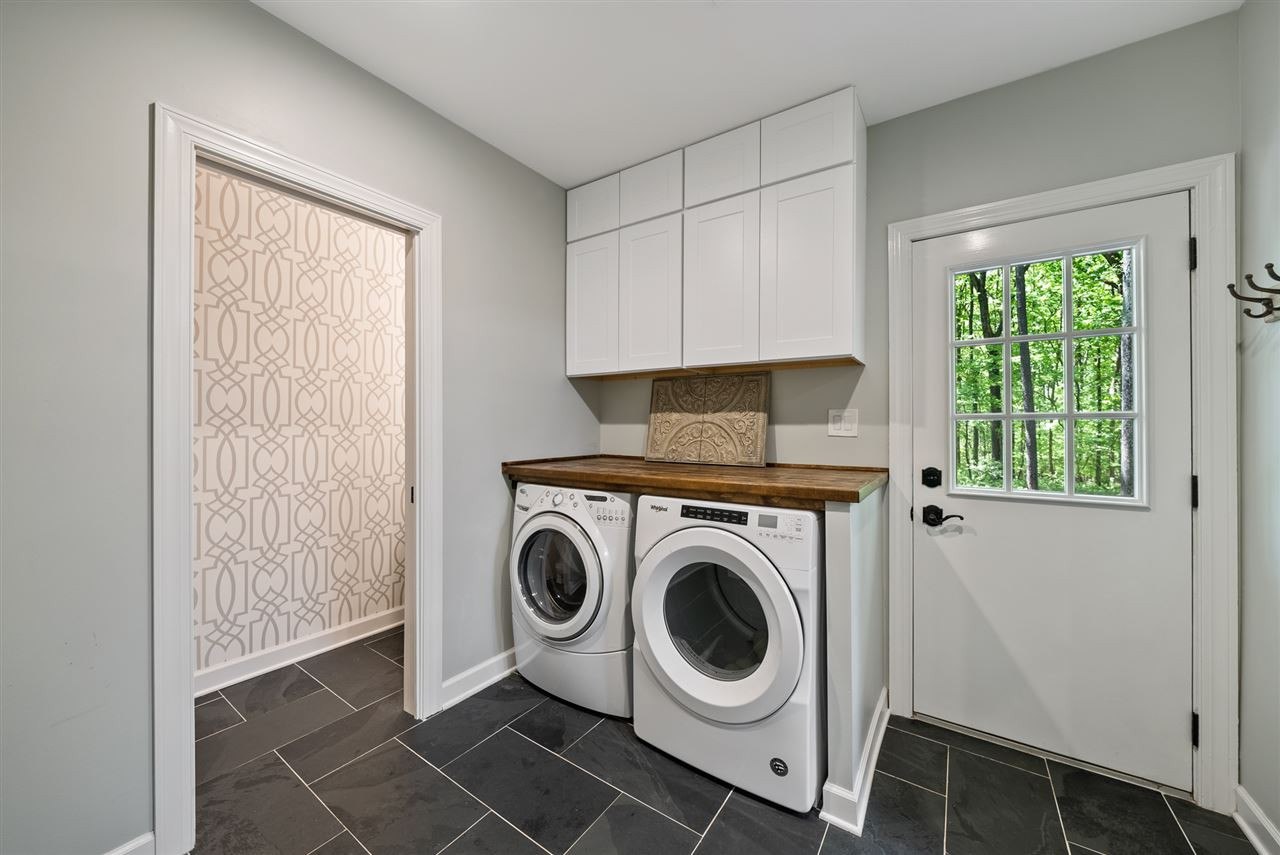 9421 Barton Creek Road Raleigh, NC 27615 - Photo 17 of 30 a utility room with dryer and washer