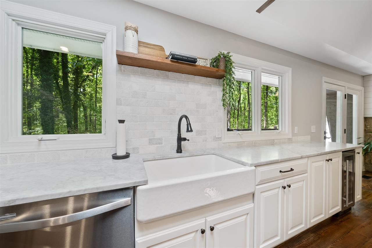 9421 Barton Creek Road Raleigh, NC 27615 - Photo 2 of 30 a kitchen with a sink and a window