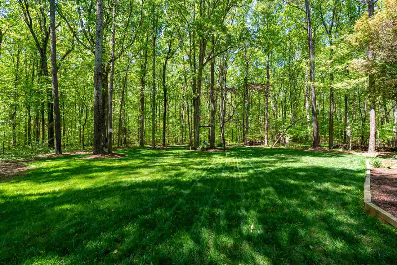 9421 Barton Creek Road Raleigh, NC 27615 - Photo 25 of 30 a view of outdoor space with deck and yard