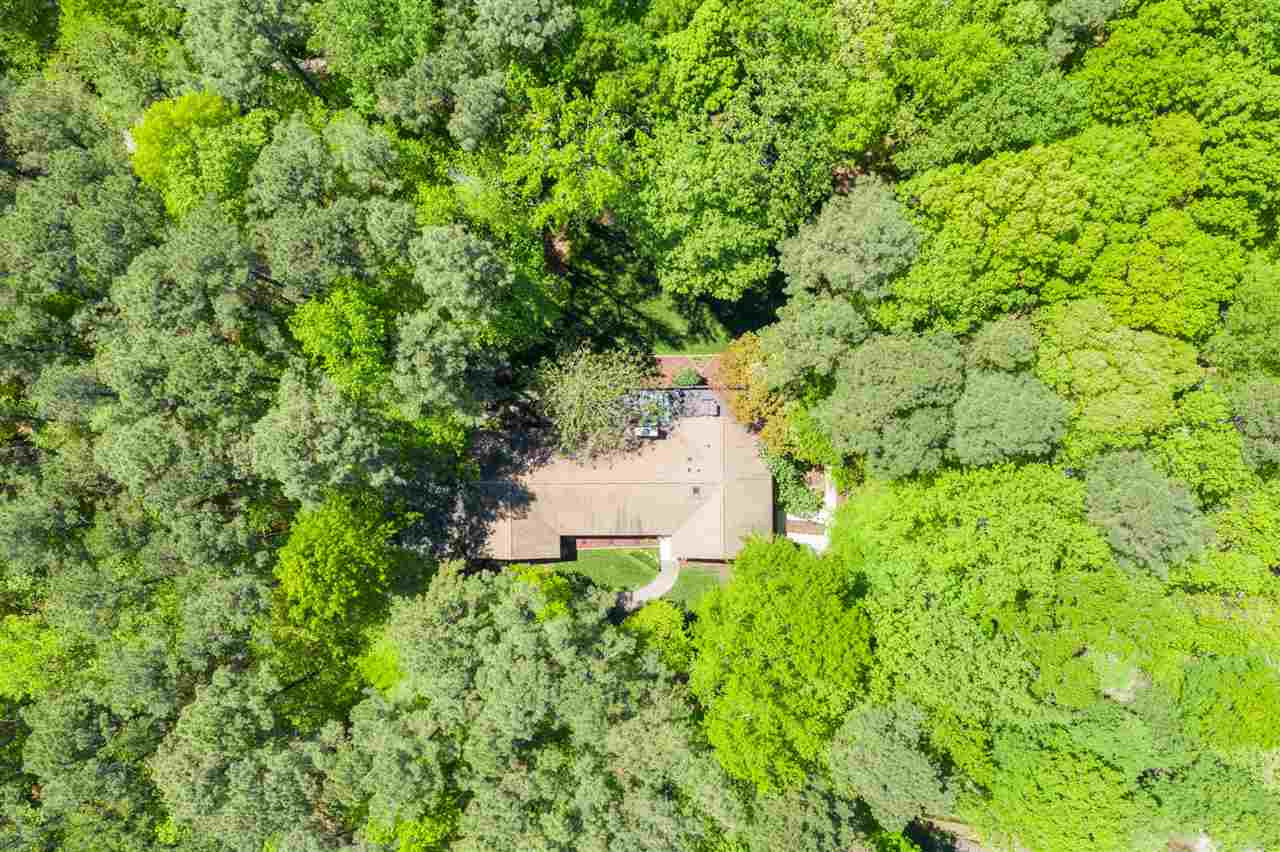 9421 Barton Creek Road Raleigh, NC 27615 - Photo 28 of 30 a view of a house with a tree