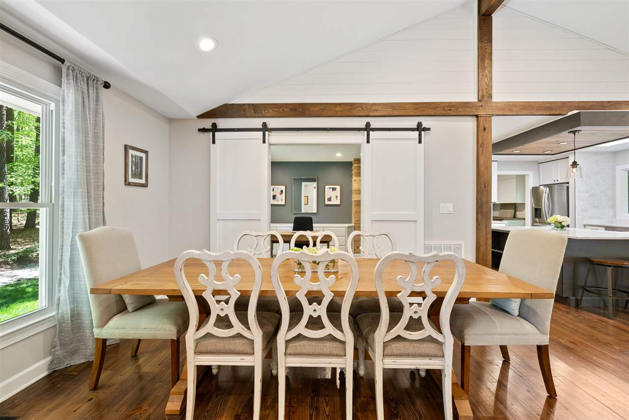 9421 Barton Creek Road Raleigh, NC 27615 - Photo 4 of 30 a view of a dining room with furniture window and wooden floor