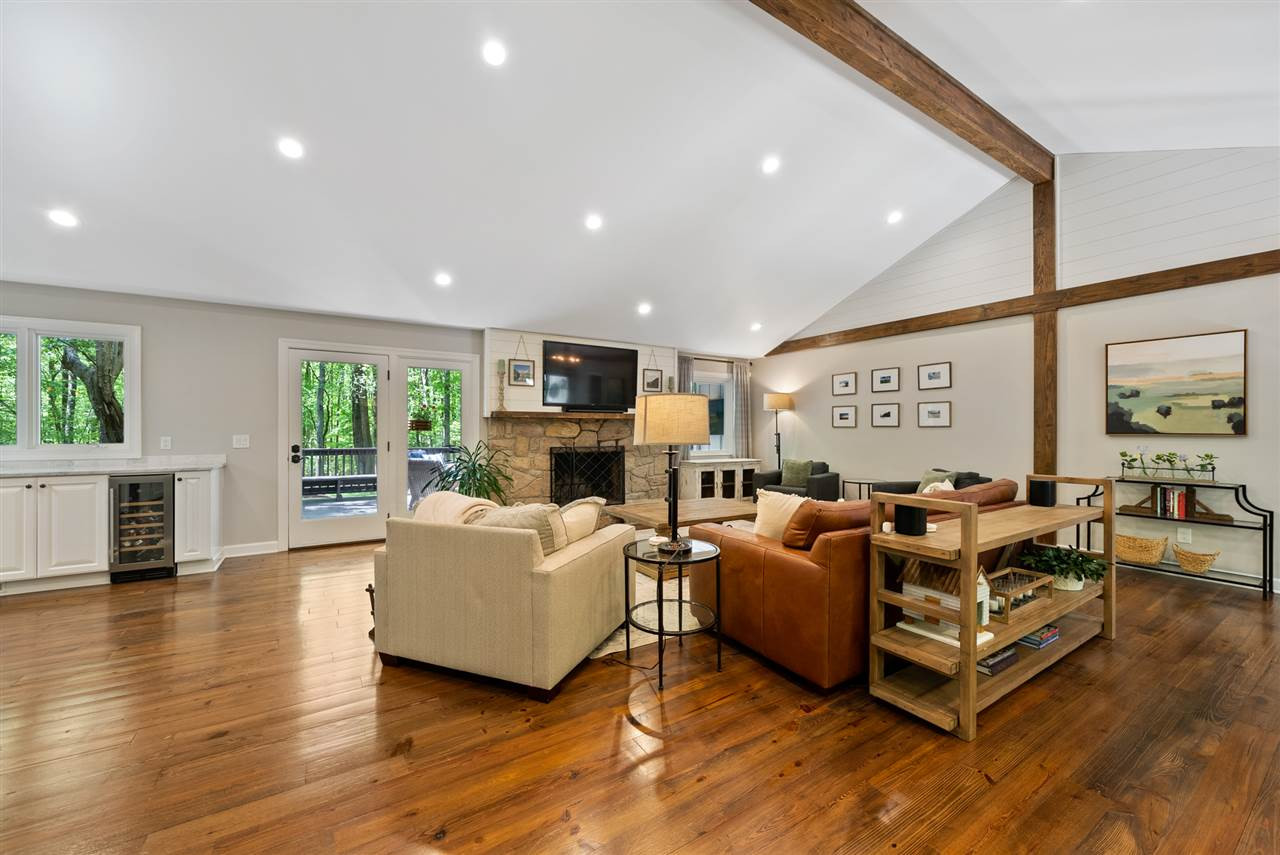 9421 Barton Creek Road Raleigh, NC 27615 - Photo 7 of 30 a living room with furniture wooden floor and a fireplace