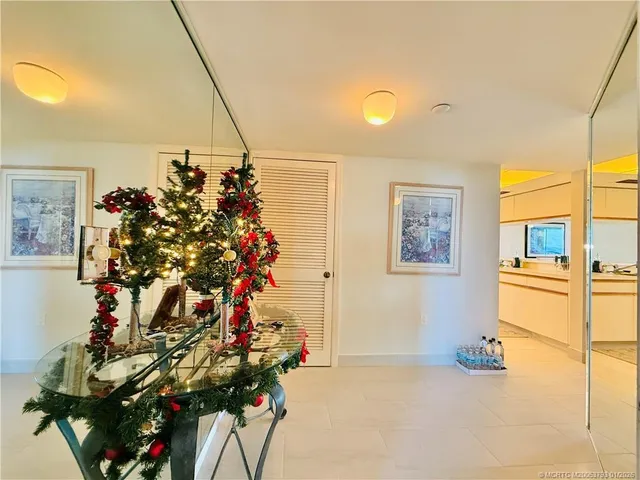 a large kitchen with a stove a refrigerator and a sink