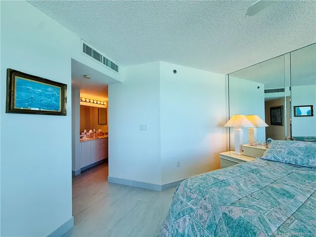 a view of a balcony with chair and wooden floor