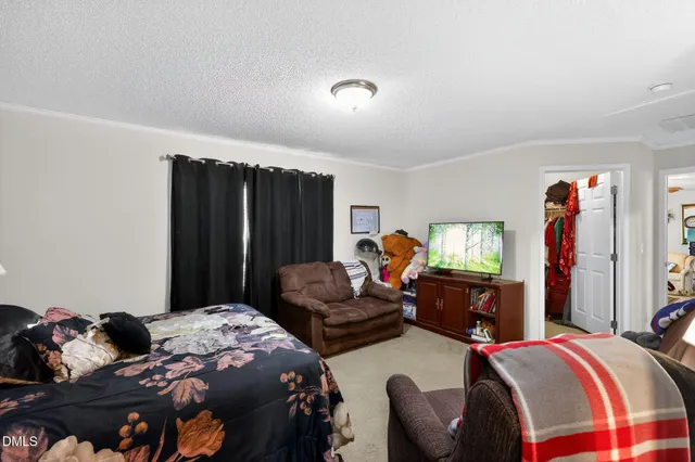 a bedroom with two beds and a window