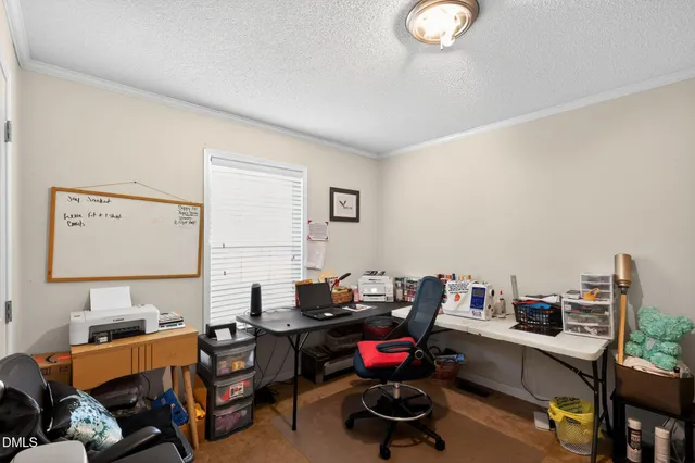 a room with furniture a rug and a window