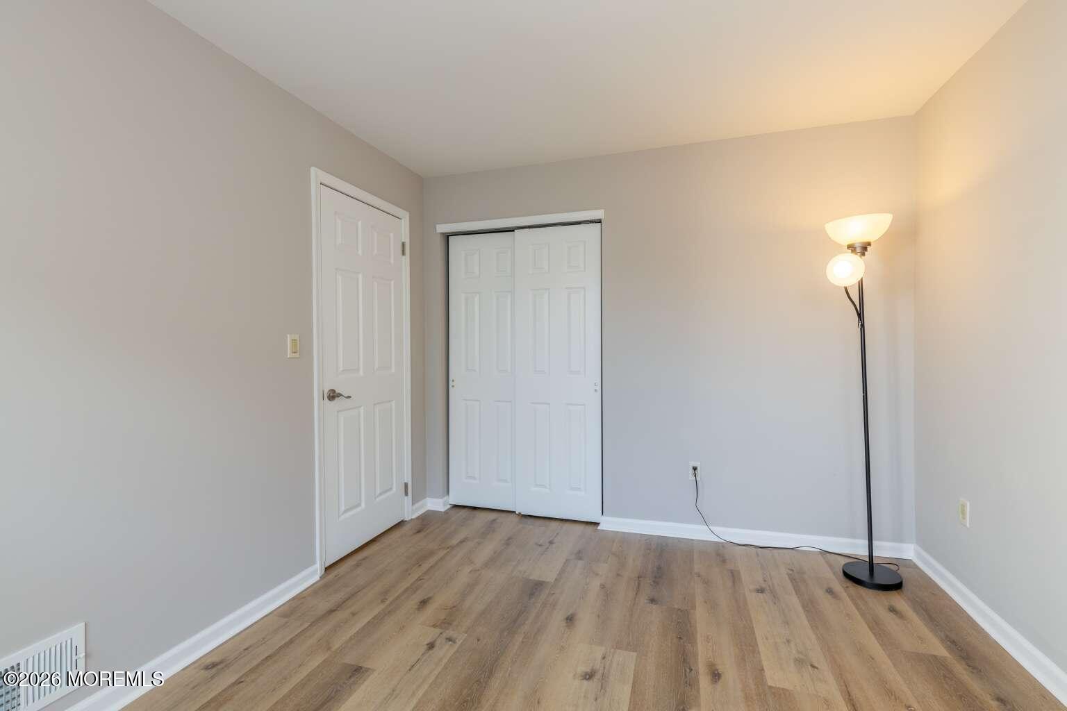43 Poplar Place Freehold, NJ 07728 - Photo 14 of 31 wooden floor in a room