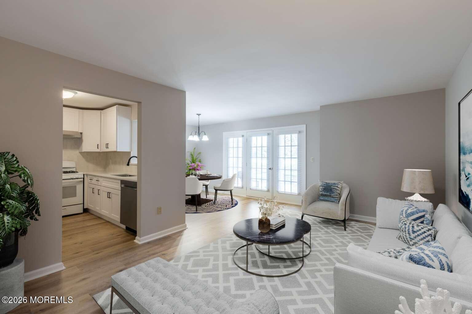 43 Poplar Place Freehold, NJ 07728 - Photo 2 of 31 a living room with furniture and a wooden floor