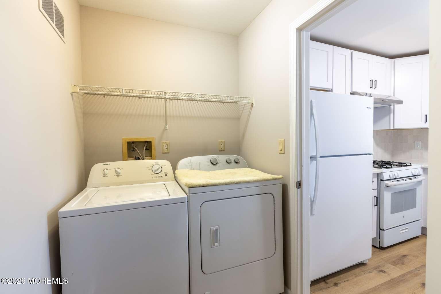 43 Poplar Place Freehold, NJ 07728 - Photo 23 of 31 a utility room with dryer and washer