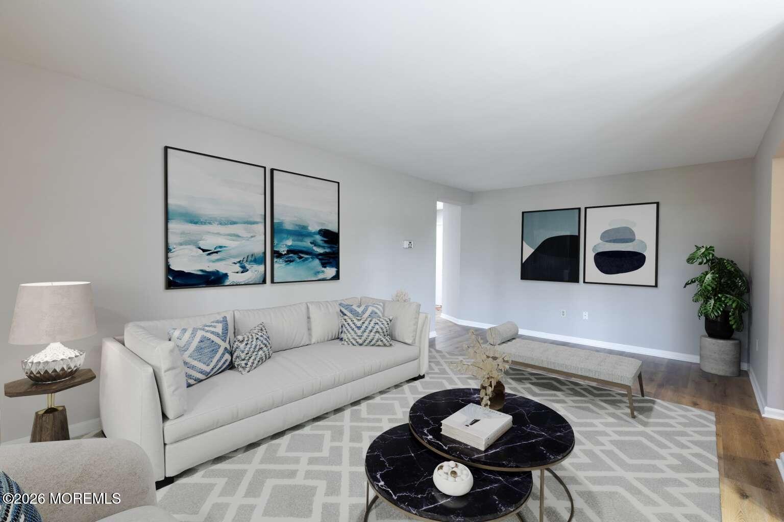 43 Poplar Place Freehold, NJ 07728 - Photo 4 of 31 a living room with furniture and a rug