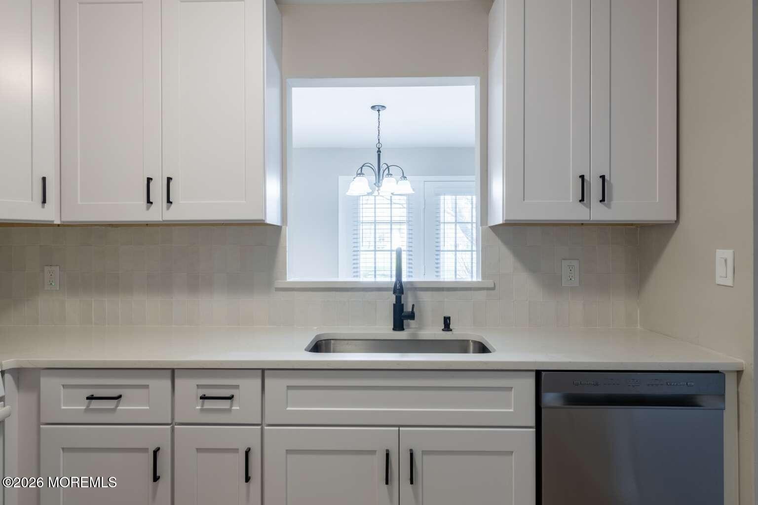 43 Poplar Place Freehold, NJ 07728 - Photo 8 of 31 a kitchen with cabinets appliances and a sink
