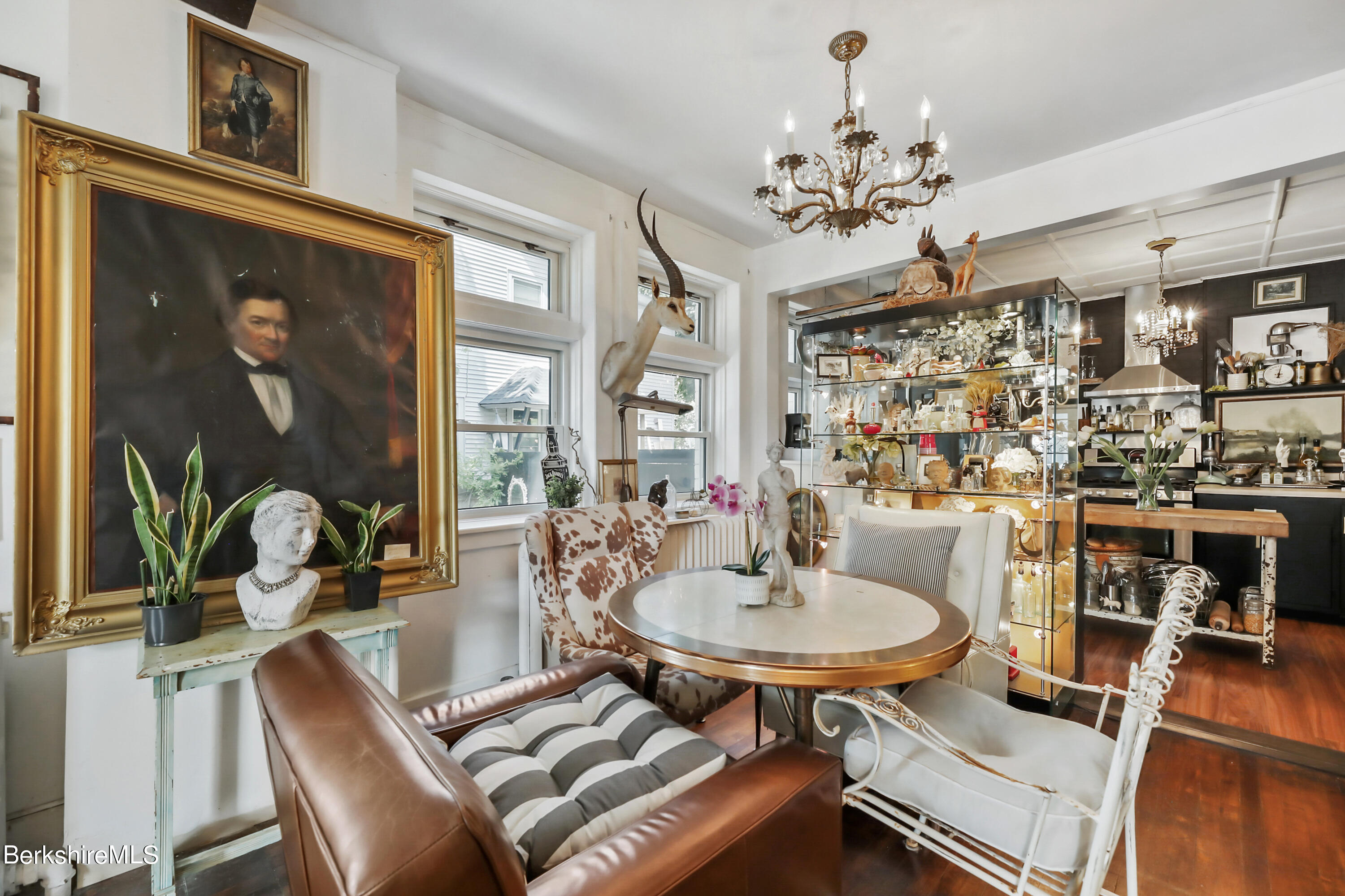 7 Lincoln Street Pittsfield, MA 01201 - Photo 7 of 25 a dining room with wooden floor a chandelier a glass table and chairs