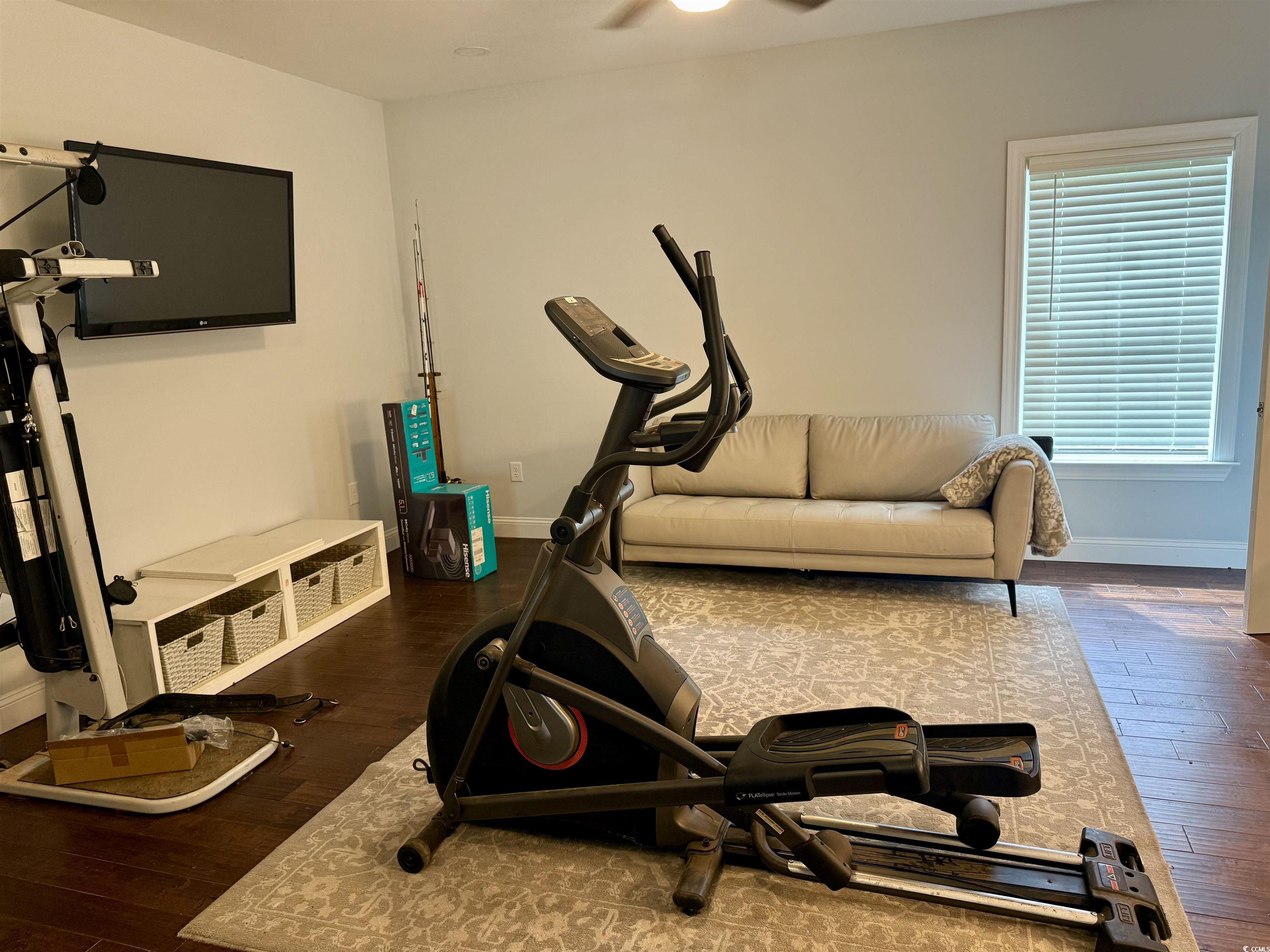 100 Oak Bay Drive Georgetown, SC 29440 - Photo 11 of 29 Exercise area featuring dark wood-style flooring and a ceiling fan