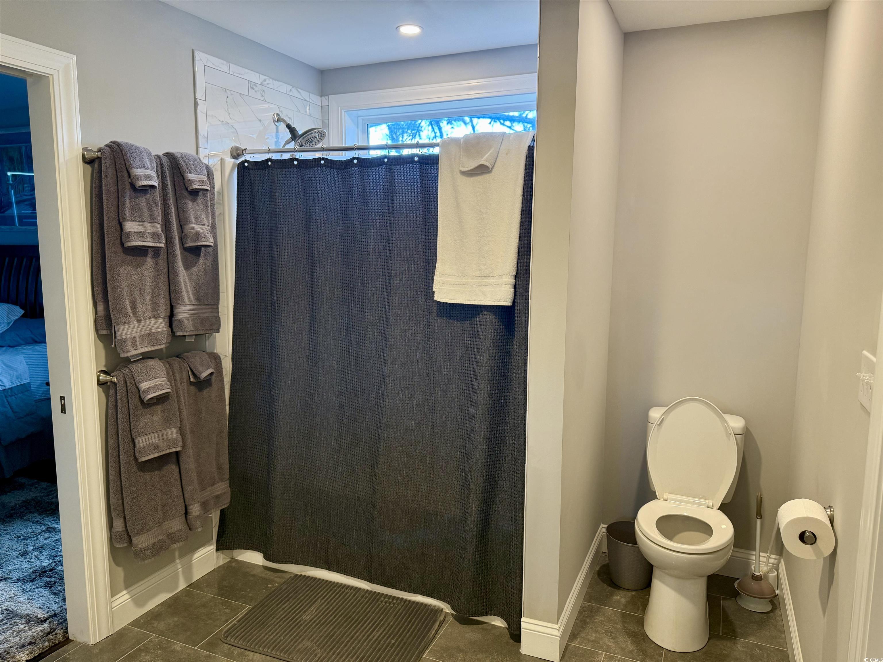 100 Oak Bay Drive Georgetown, SC 29440 - Photo 16 of 29 Ensuite bathroom with tile patterned flooring and a shower stall