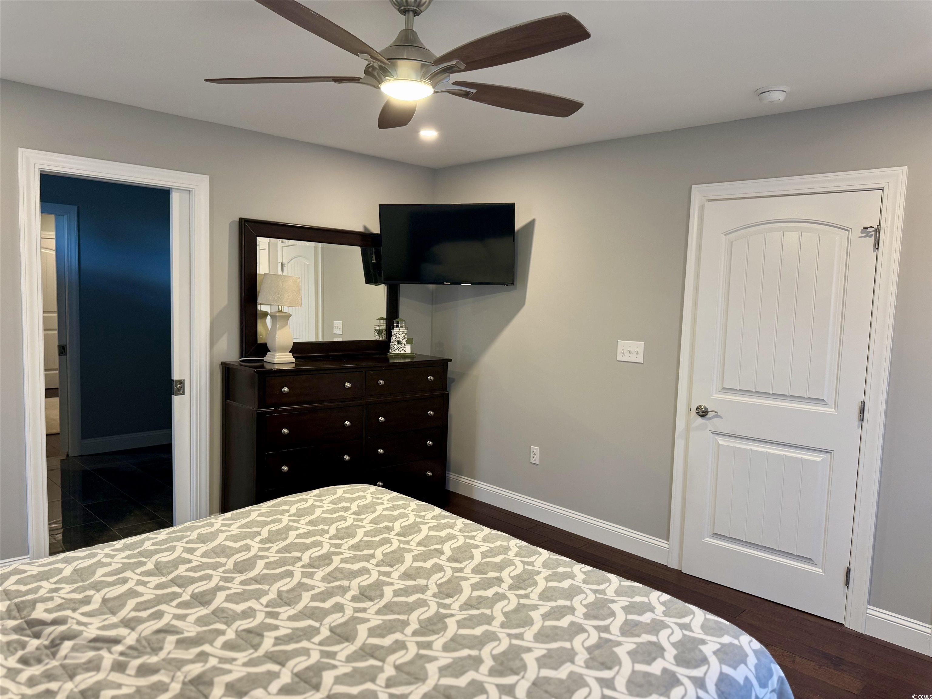 100 Oak Bay Drive Georgetown, SC 29440 - Photo 18 of 29 Bedroom with dark wood finished floors, ceiling fan, and recessed lighting