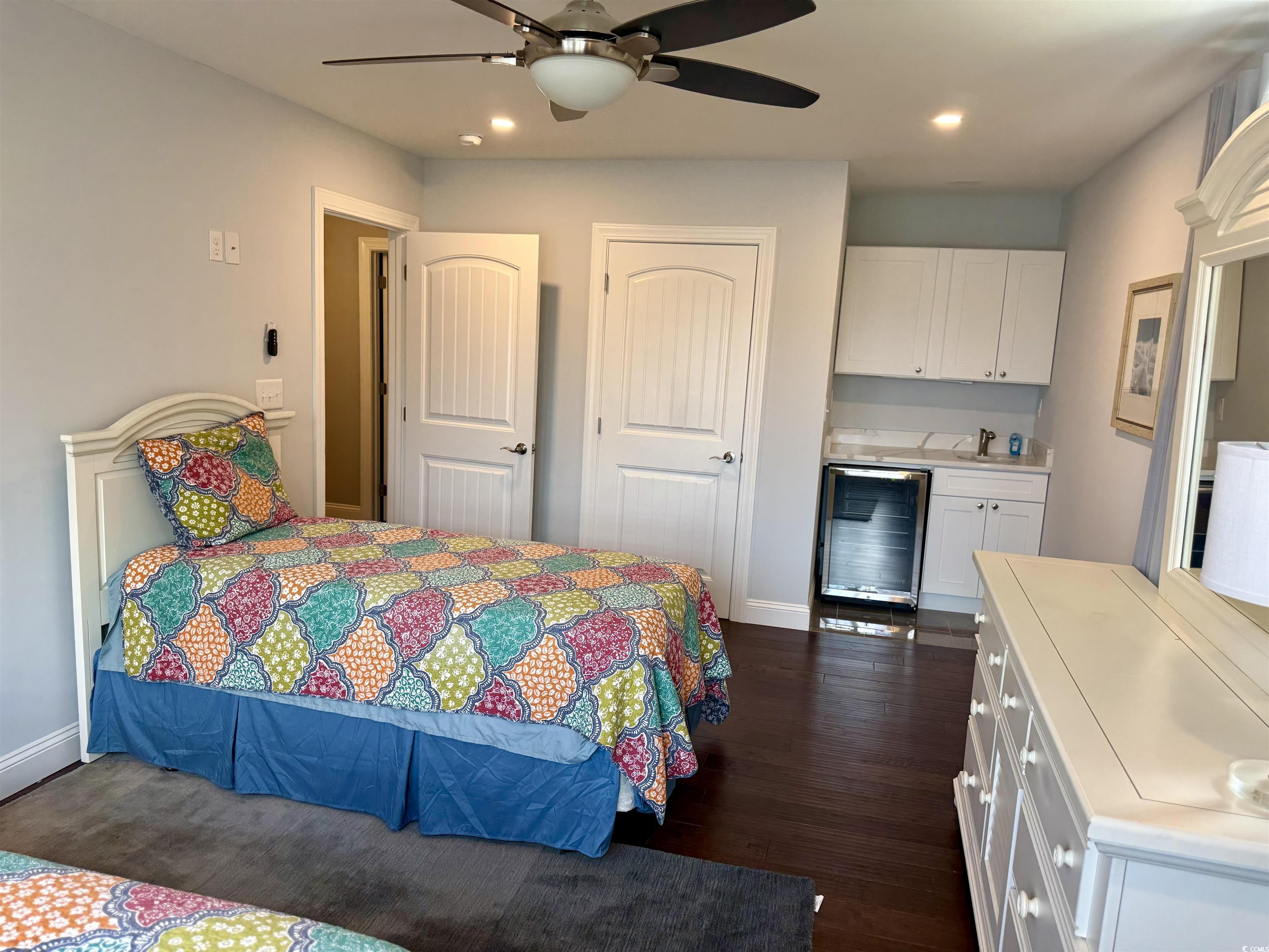 100 Oak Bay Drive Georgetown, SC 29440 - Photo 20 of 29 Bedroom with recessed lighting, wine cooler, dark wood-type flooring, a ceiling fan, and a closet