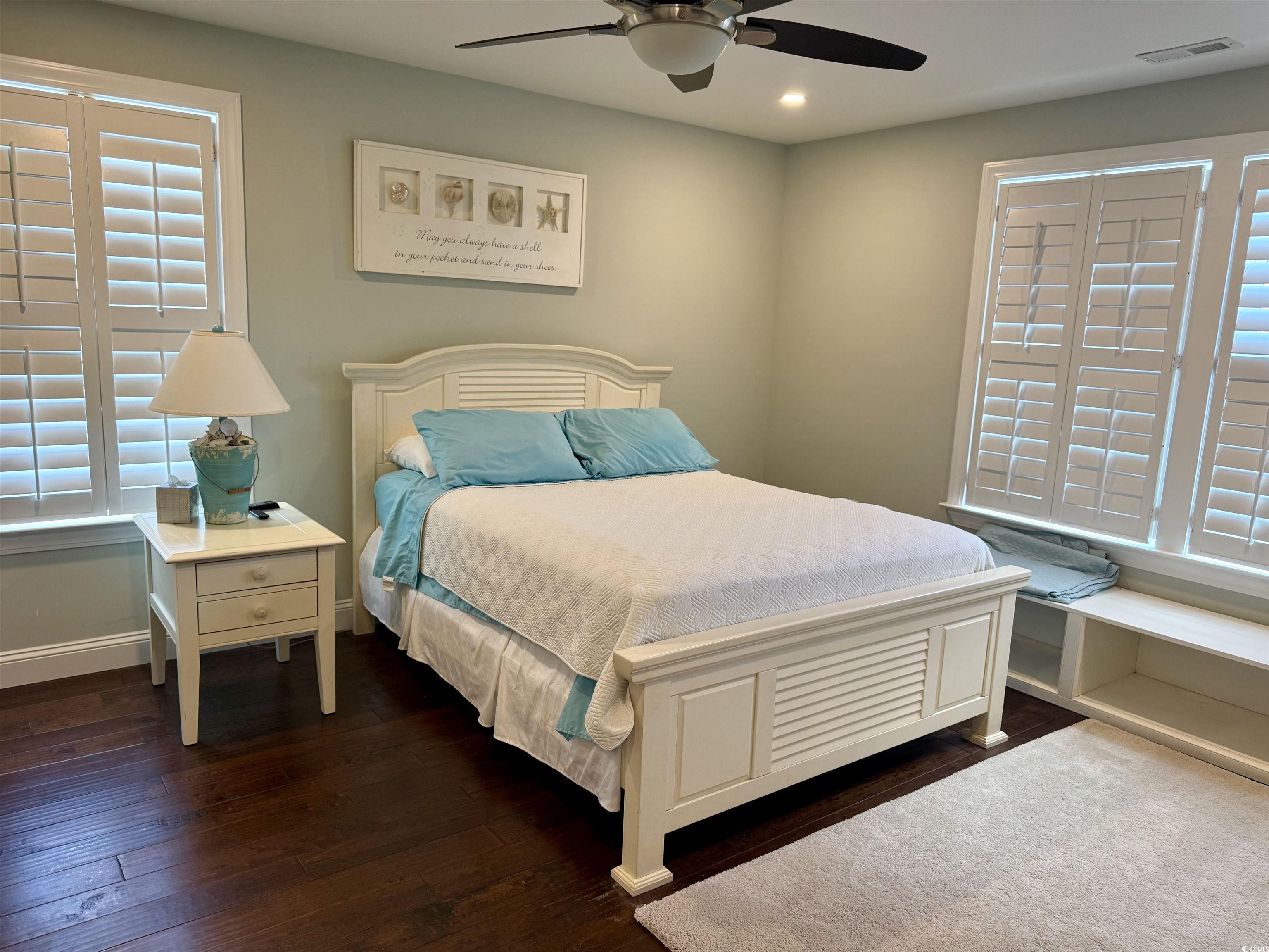 100 Oak Bay Drive Georgetown, SC 29440 - Photo 24 of 33 Bedroom featuring dark wood-style floors, a ceiling fan, recessed lighting, and multiple windows