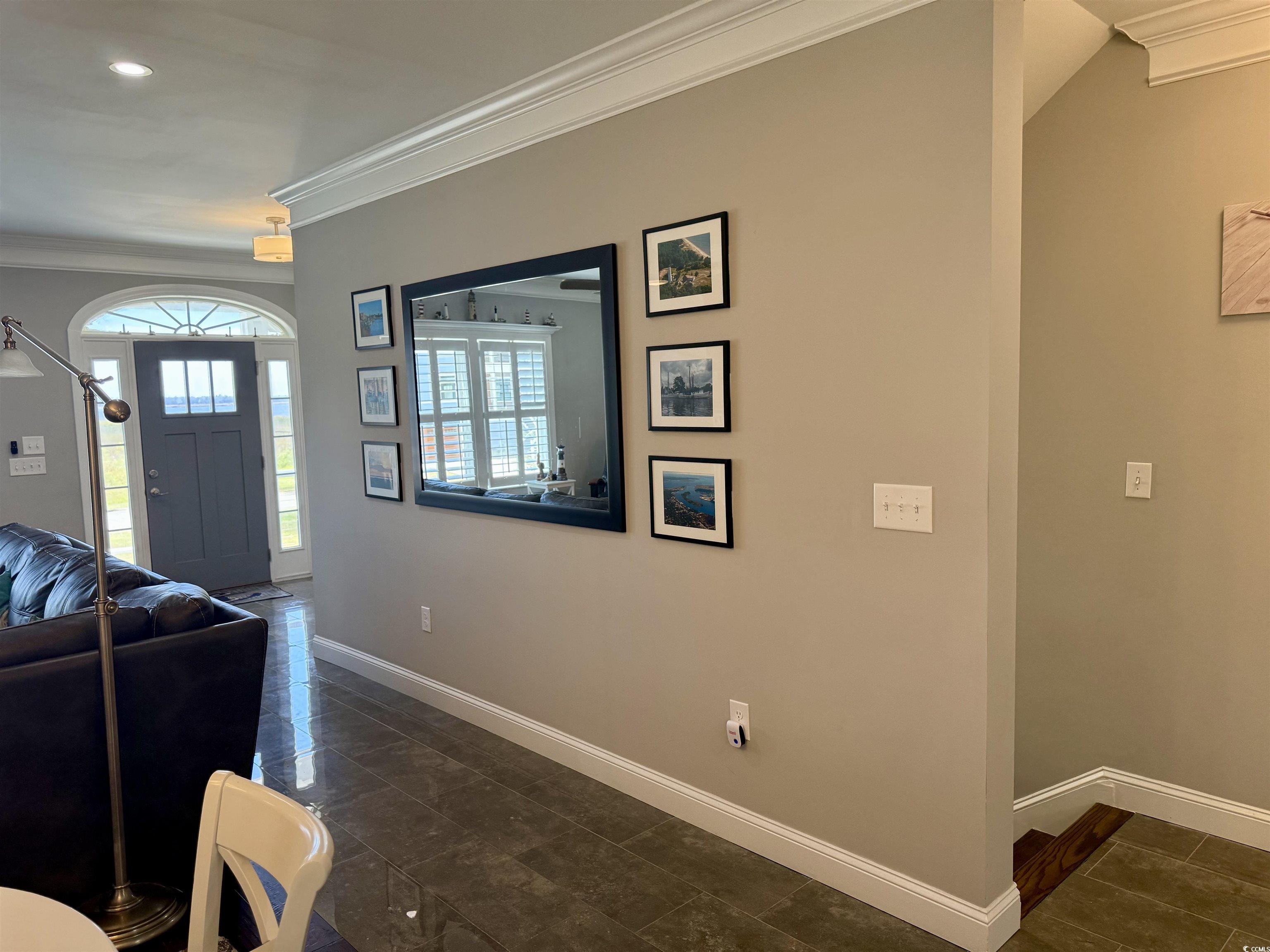 100 Oak Bay Drive Georgetown, SC 29440 - Photo 5 of 29 Living room with ornamental molding, dark tile patterned flooring, and recessed lighting