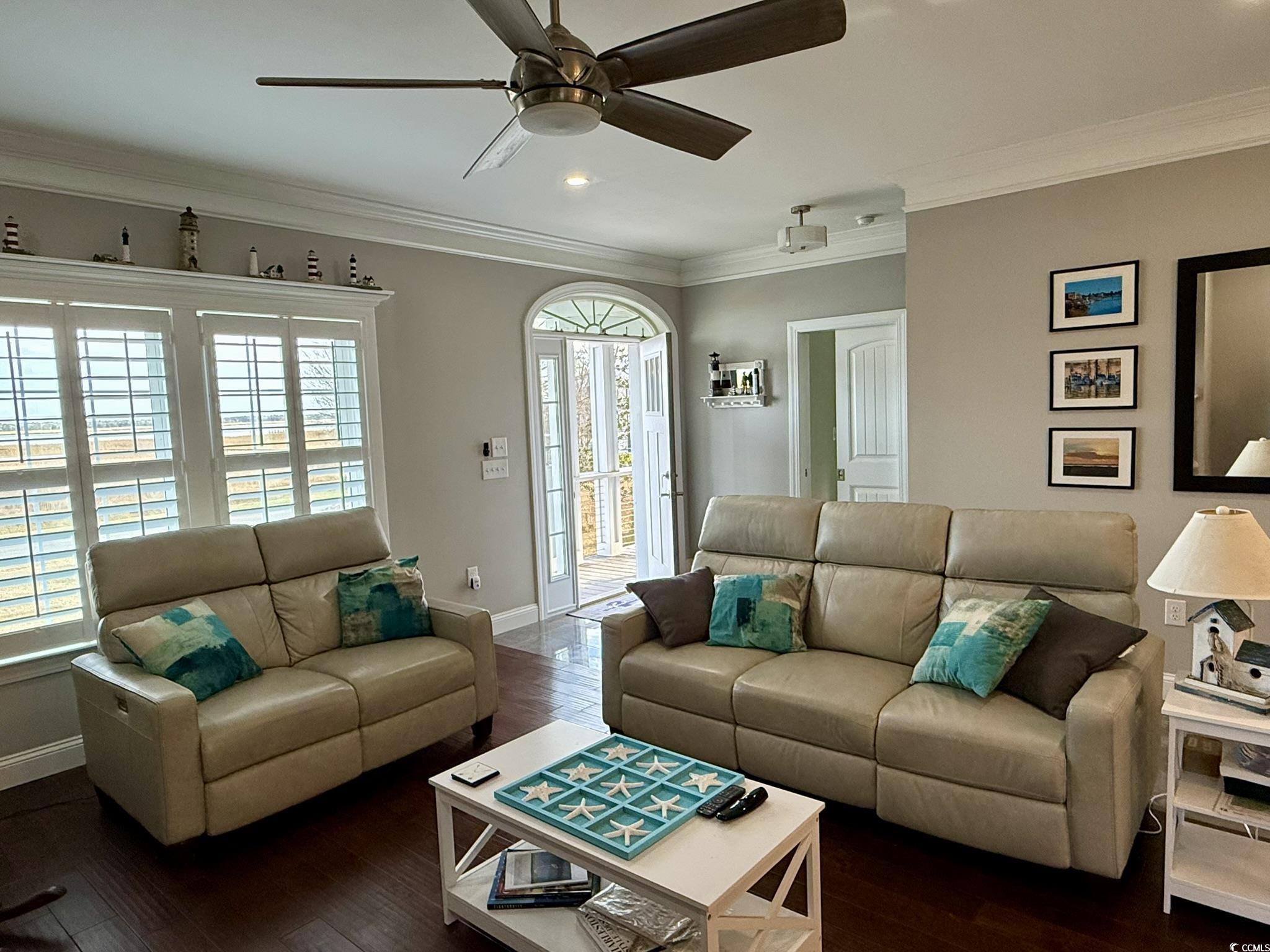100 Oak Bay Drive Georgetown, SC 29440 - Photo 7 of 33 Living area with a ceiling fan, dark wood finished floors, crown molding, healthy amount of natural light, and recessed lighting