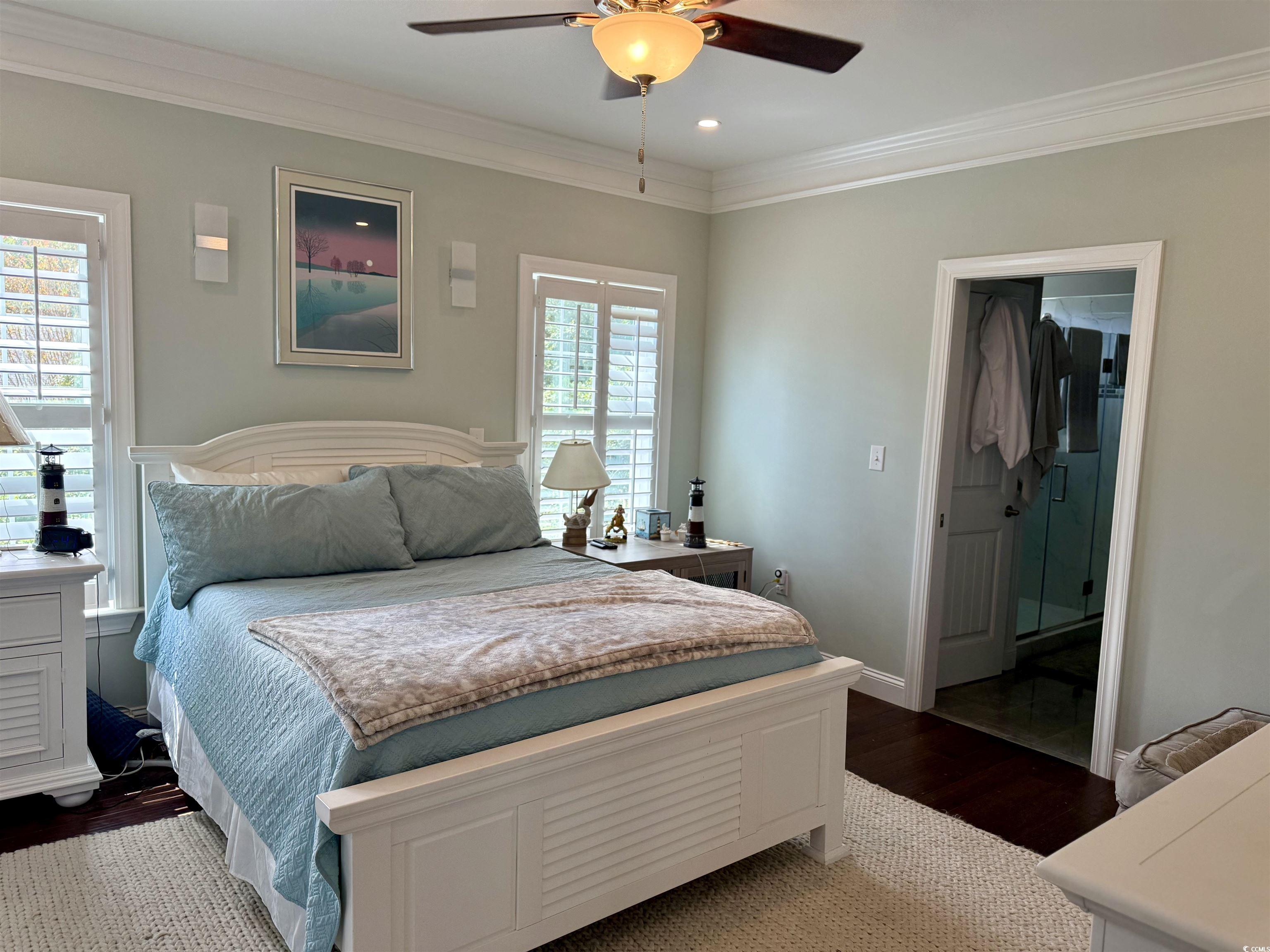 100 Oak Bay Drive Georgetown, SC 29440 - Photo 7 of 29 Bedroom featuring crown molding, dark wood finished floors, a ceiling fan, recessed lighting, and connected bathroom