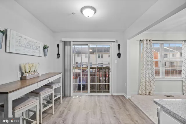 a view of a livingroom with furniture and windows