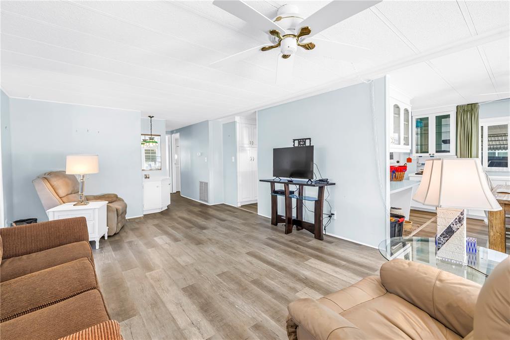 1100 South Belcher Road, Unit 502 Largo, FL 33771 - Photo 15 of 51 a bedroom with furniture and a flat screen tv