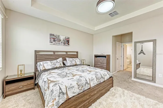 a bedroom with a bed and a couch