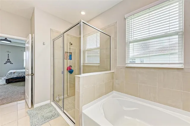 a bathroom with a bathtub and shower