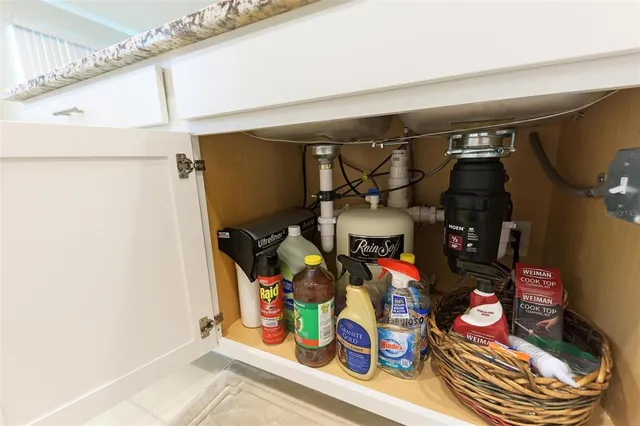 a dining room with furniture and a window