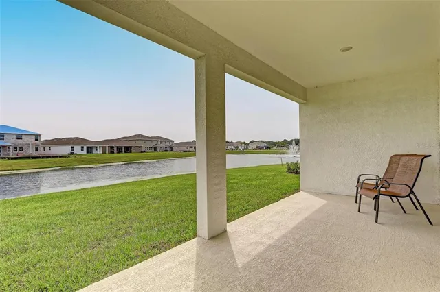 a view of a backyard with table and chairs