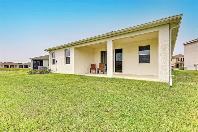 a view of a lake with houses in the back