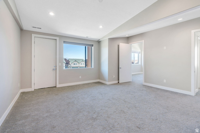 7045 South 300 East Midvale, UT 84047 - Photo 17 of 49 Carpeted room with neutral wall tones and recessed lighting