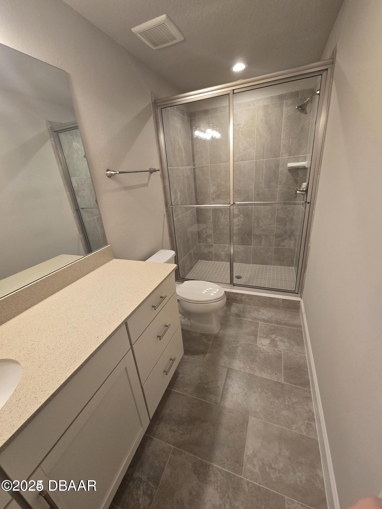 54 Longridge Lane Ormond Beach, FL 32174 - Photo 11 of 16 a bathroom with a shower toilet and sink