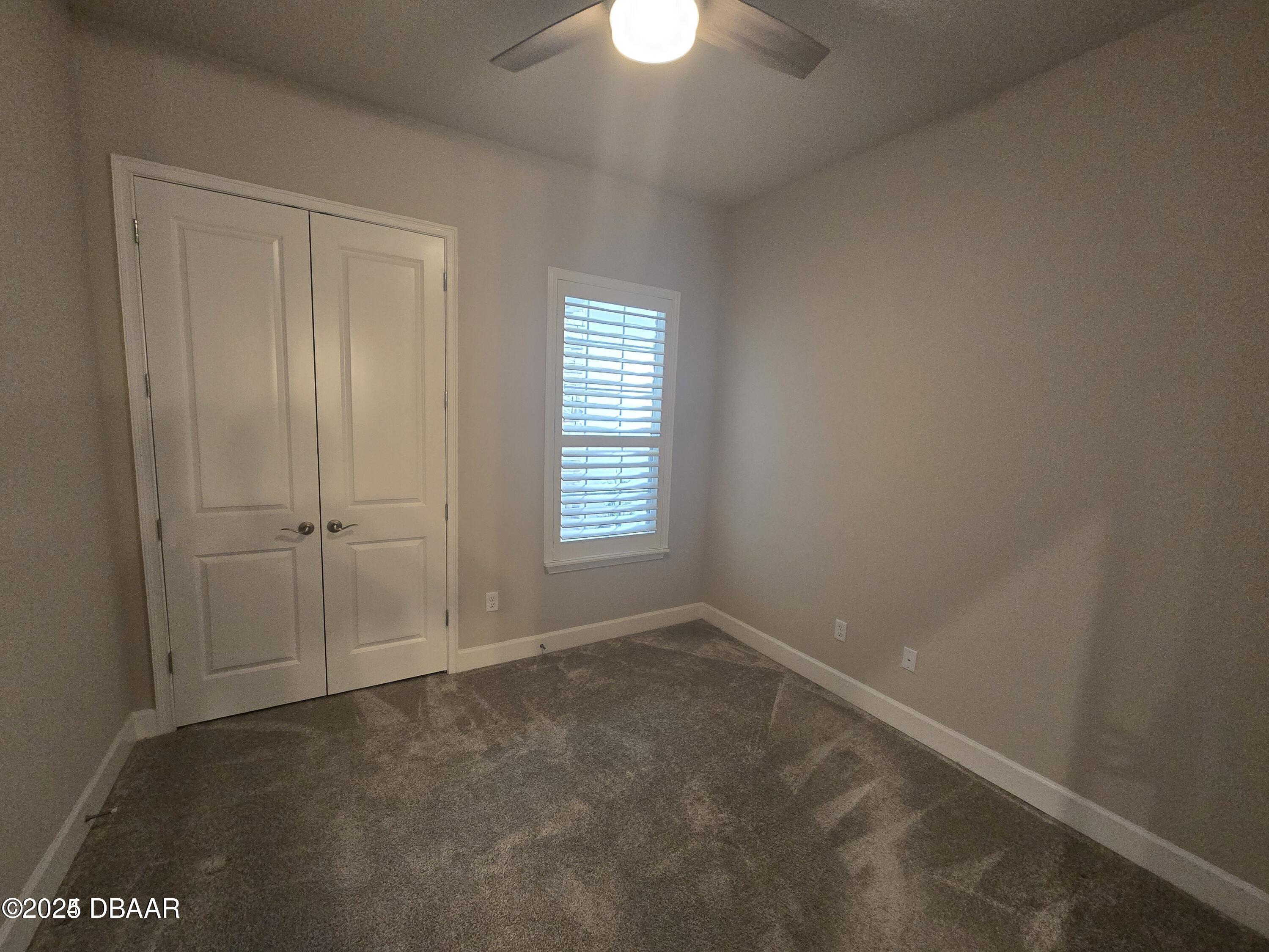 54 Longridge Lane Ormond Beach, FL 32174 - Photo 12 of 16 an empty room with a empty space and a window