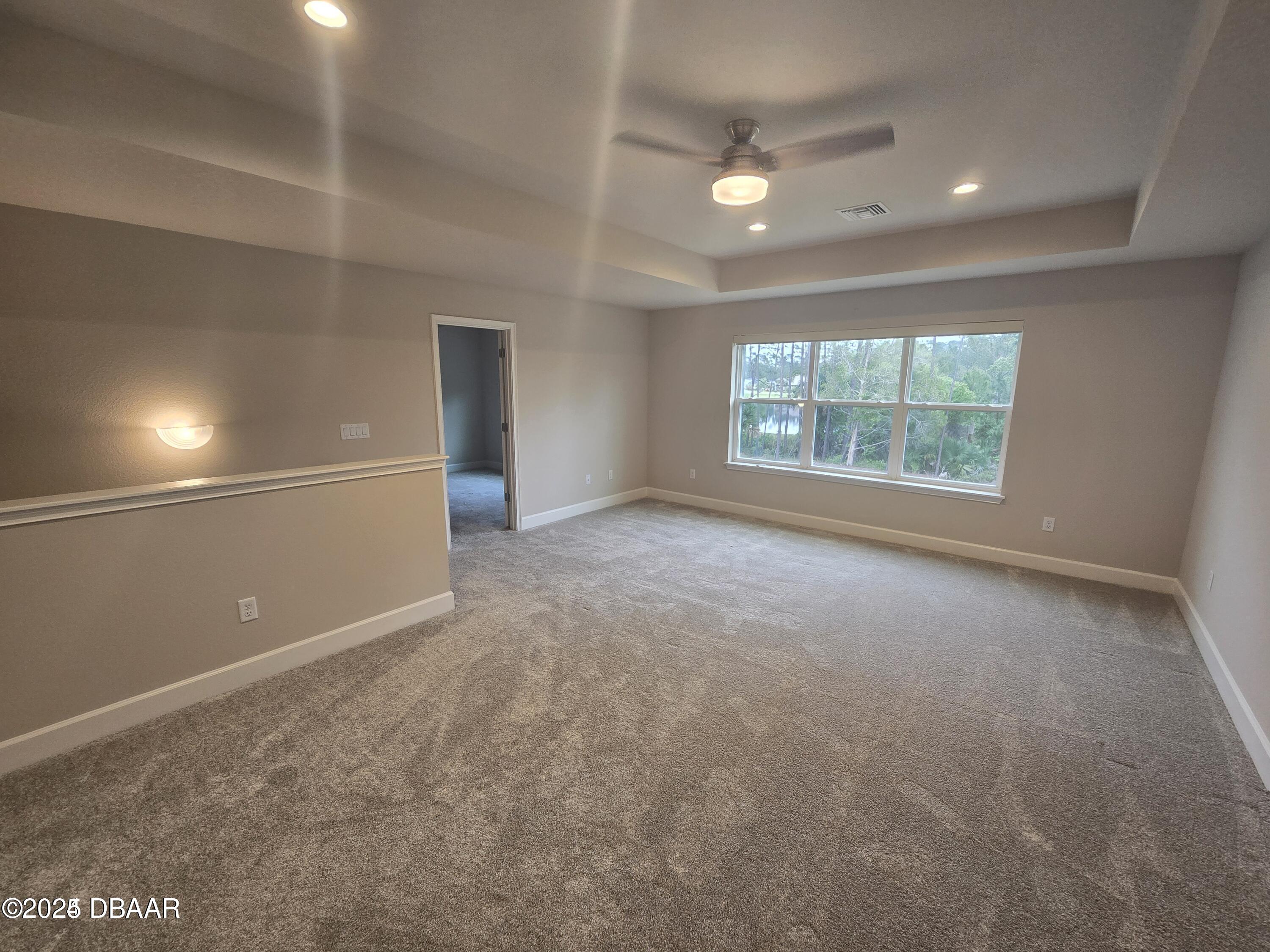 54 Longridge Lane Ormond Beach, FL 32174 - Photo 13 of 16 an empty room with windows