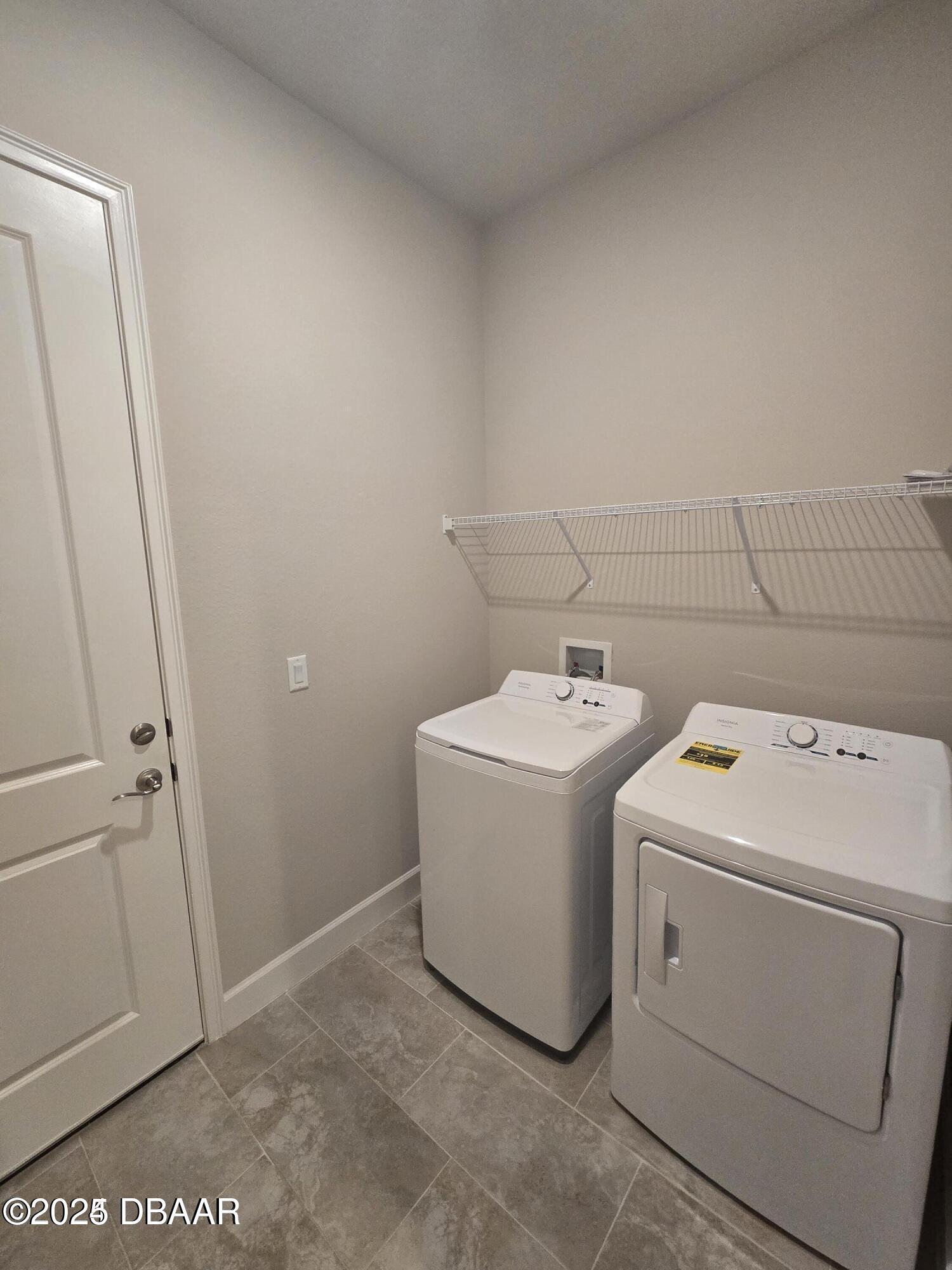 54 Longridge Lane Ormond Beach, FL 32174 - Photo 15 of 16 a utility room with dryer and washer